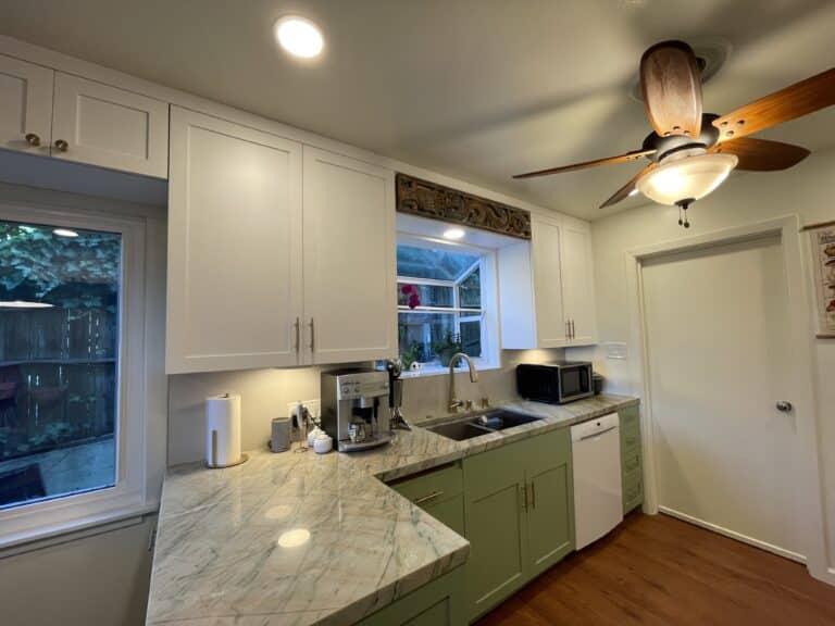 White and green kitchen remodeling in Los Angeles with marble counter top