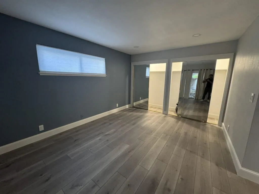 Modern wood-look flooring and refreshed living area in North Hollywood remodel.