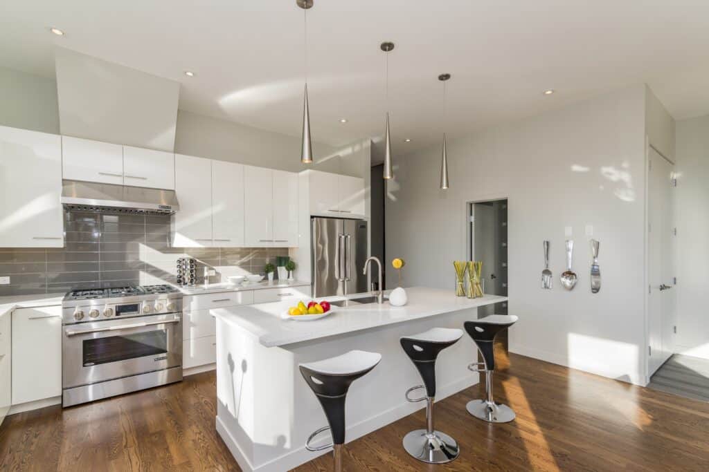 Neutral color white and creme modern open kitchen.
