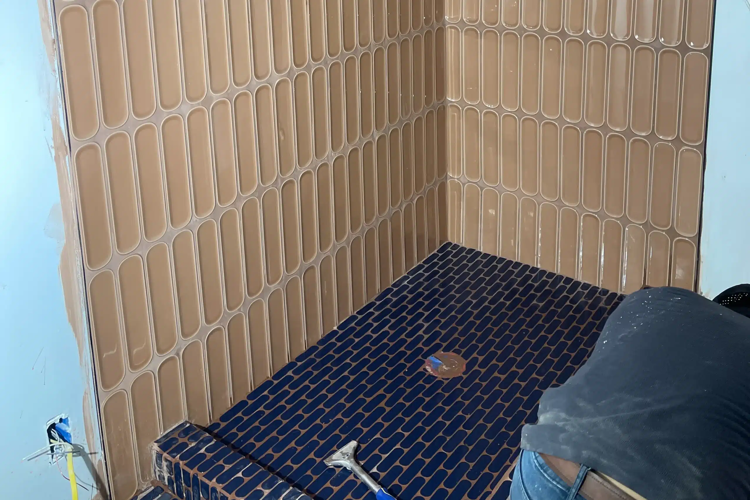 Detailed bathroom tile installation showcasing unique tile patterns and finishes for Los Angeles bathroom remodels.