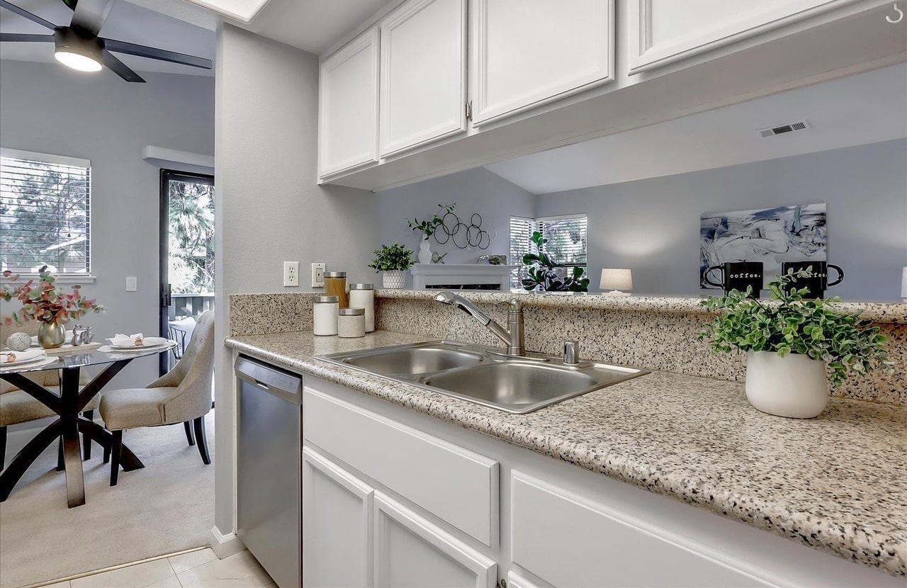 White kitchen with granite countertops
